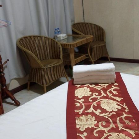 Song Xing Hotel Муанг-Сай Экстерьер фото